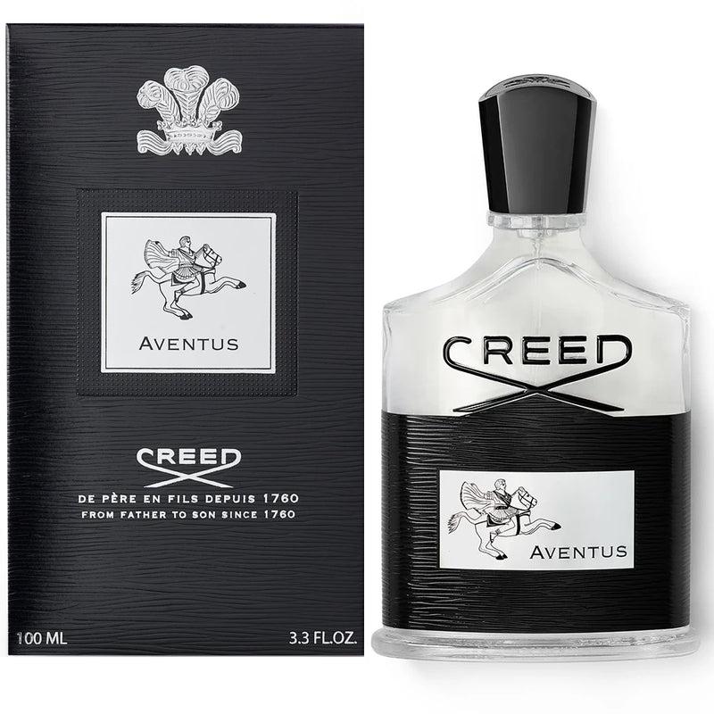 Creed Aventus perfume bottle and its black textured packaging box, featuring the winged horse logo and silver lettering on a white background.