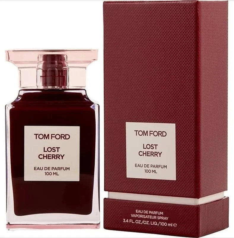 Tom Ford Lost Cherry Eau de Parfum 100ml bottle next to its textured dark red packaging box, on a white background.