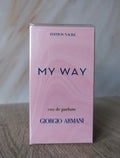Giorgio Armani My Way Eau de Parfum box in Edition Nacre, featuring a light pink marbled design with dark blue lettering, standing on a wooden surface.